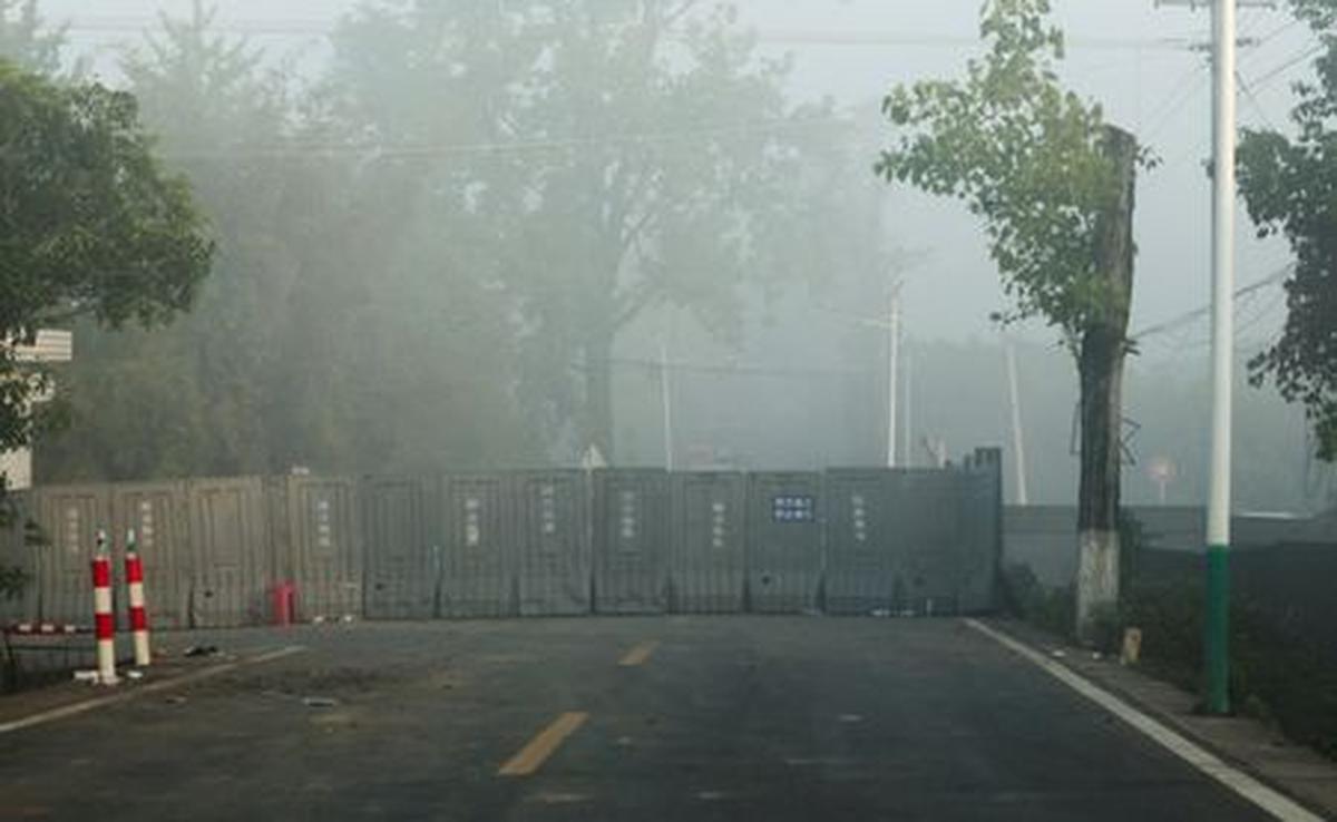 A barrier blocks a road near the site of a blast at a fireworks manufacturing factory in Liuyang, Hunan province, China, May 6, 2026. REUTERS/Maxim Shemetov