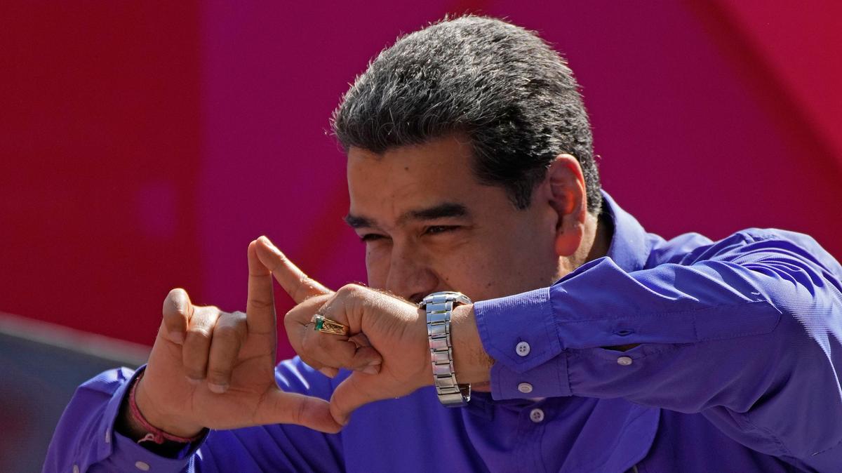 Venezuelan President Nicolás Maduro waves during a rally for Labor Day in Caracas on May 1.