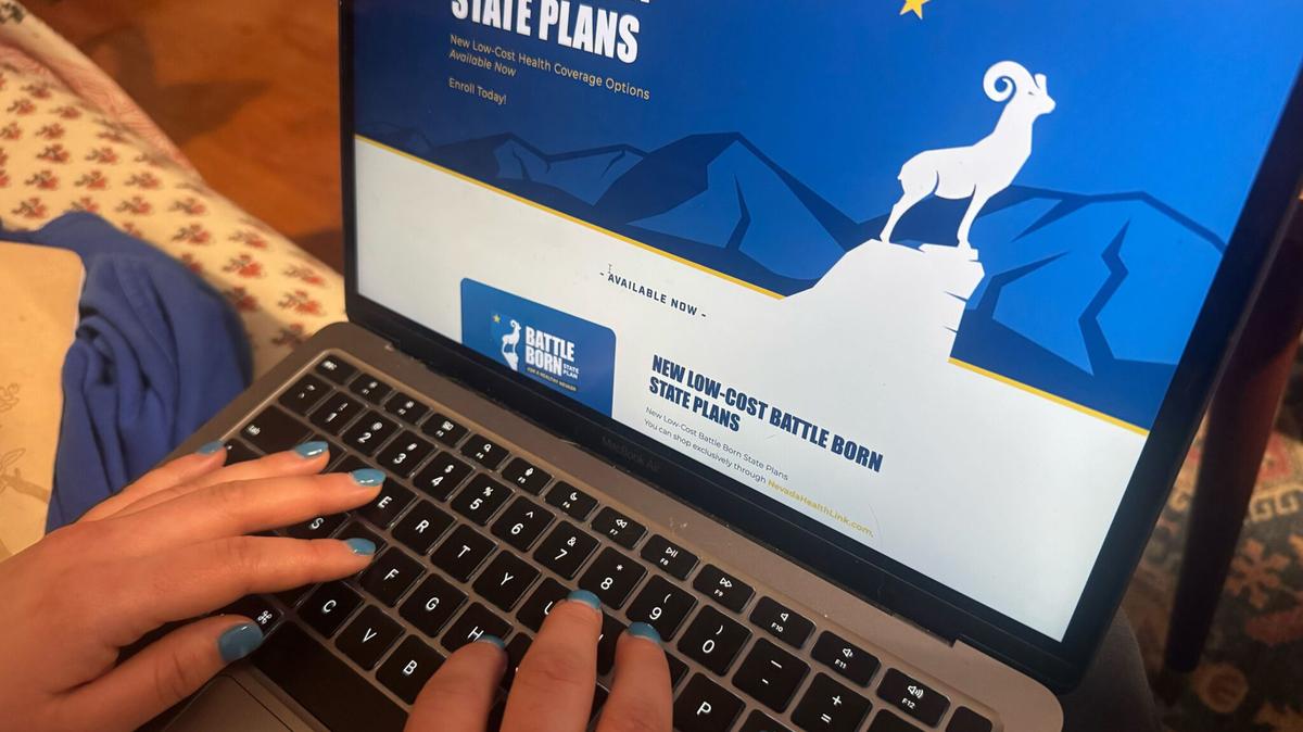 A woman looks at health insurance options on Nevada’s health exchange. This year Nevada became the third state to add a public option plan to its marketplace. (Shalina Chatlani/Stateline/TNS)
