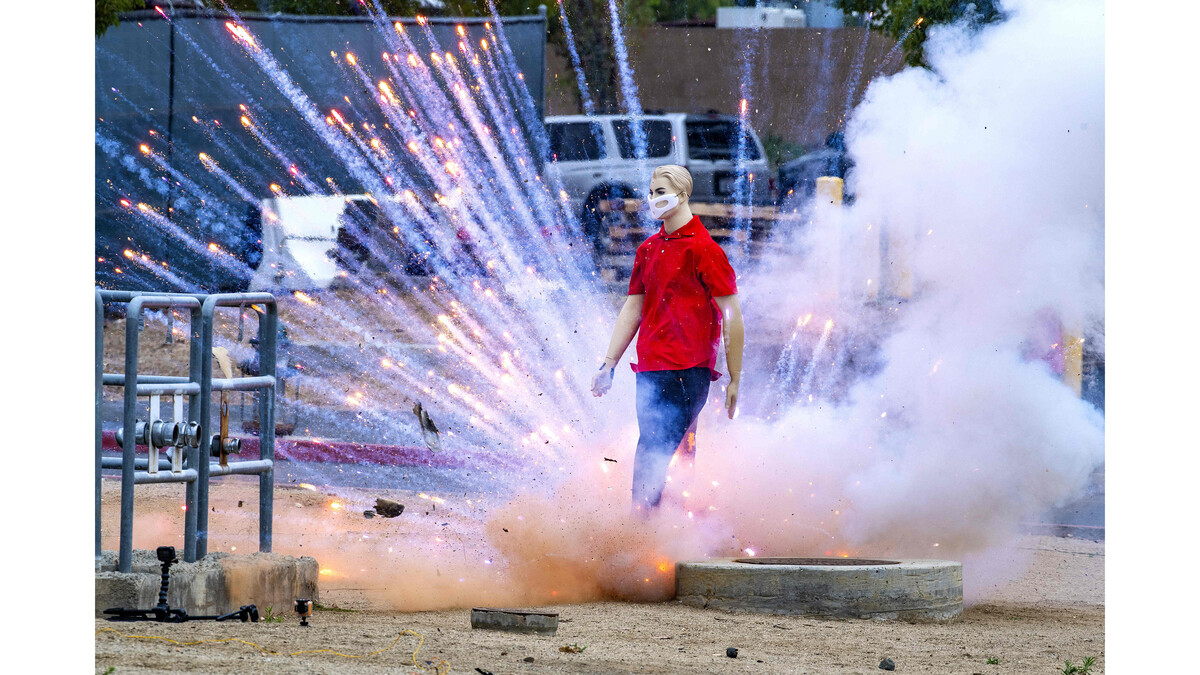 An aerial mortar goes off under the foot of a mannequin as the Orange County Fire Authority, along with the Orange County Sheriff’s Department, shows the harmful effects illegal fireworks can have on people and property during a 2020 demonstration. (Photo by Mark Rightmire, Orange County Register/SCNG)