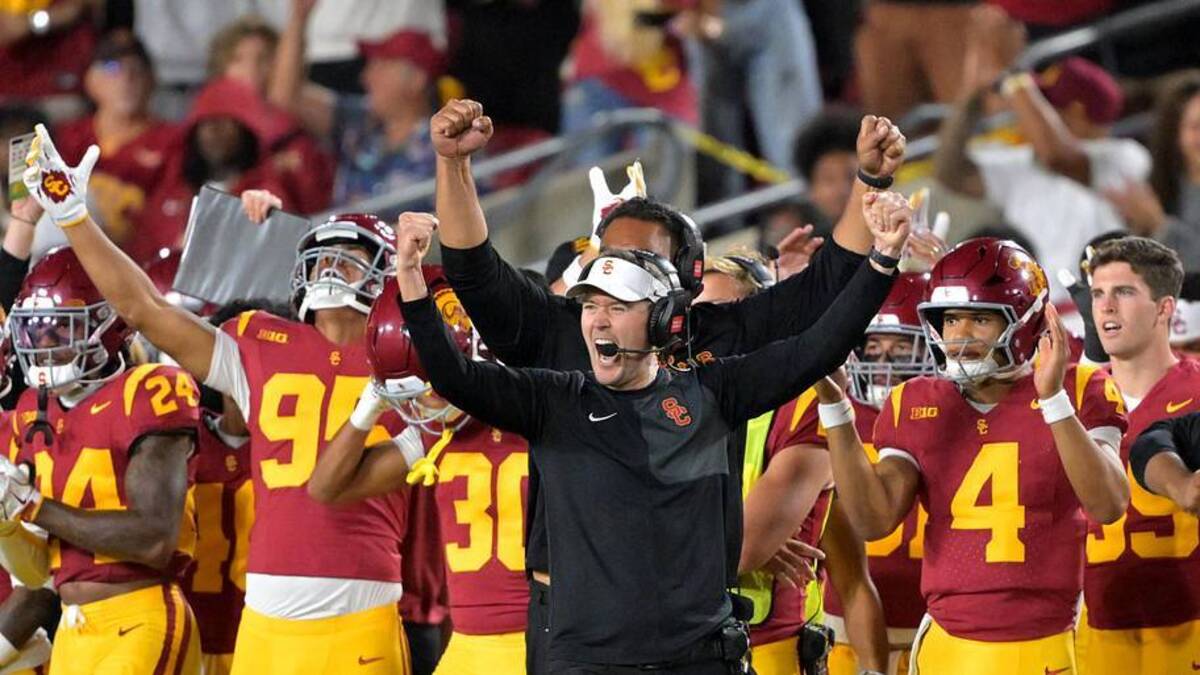  Oct 11, 2025; Los Angeles, California, USA; USC Trojans head coach Lincoln Riley (wearing white visor) celebrates along with defensive end coach Shaun Nua after kicker Ryon Sayeri (48) hit a 54-yard field goal in the second half against the Michigan Wolverines at United Airlines Field at the Los Angeles Memorial Coliseum. Mandatory Credit: Jayne Kamin-Oncea-Imagn Images | Jayne Kamin-Oncea-Imagn Images 
