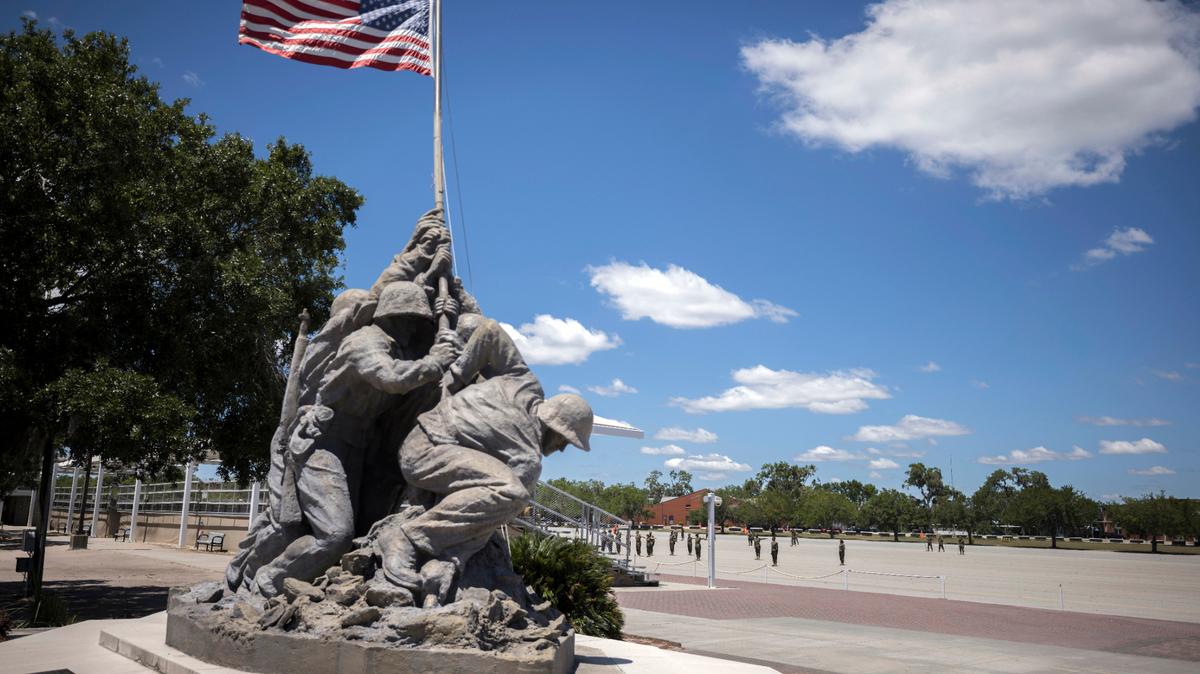 A smaller scale replica of the Marine Corps War Memorial statue stands near the parade ground at the Marine Corps Recruiting Depot, Wednesday, May 11, 2022, in Parris Island, S.C. The threat of rising seas is encroaching upon one of America’s most storied military installations, where thousands of recruits are molded into Marines each year. (AP Photo/Stephen B. Morton)