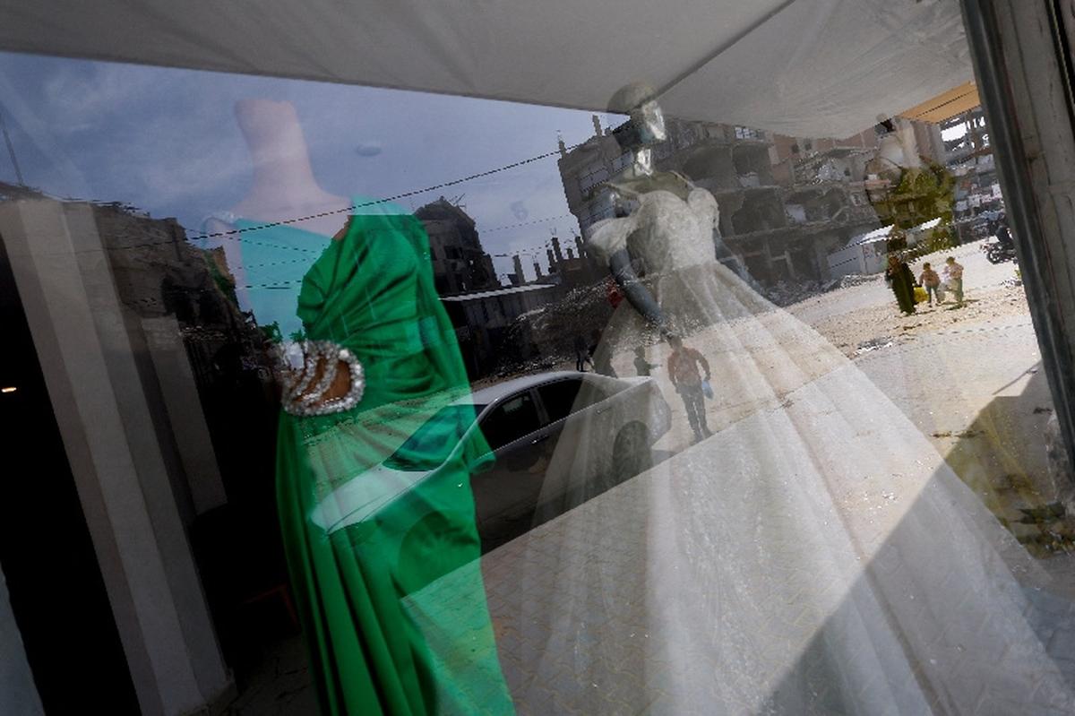 Wedding dresses are displayed at a shop, as brides in Gaza turn to reused gowns amid soaring prices and shortages caused by the war, in Khan Younis in the southern Gaza Strip, May 9, 2026. REUTERS/Mahmoud Issa