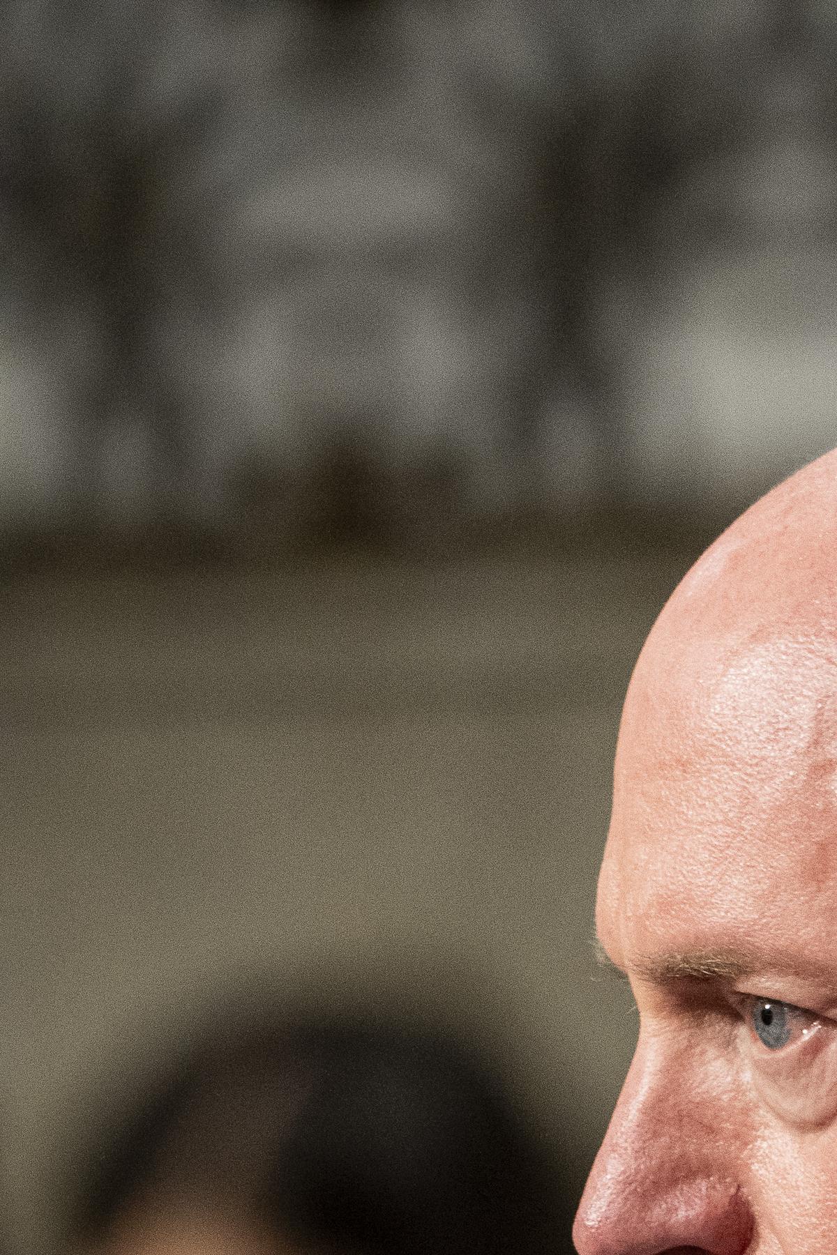 Sen. Mark Kelly (D-Ariz.) listens as Adm. Brad Cooper, the head of U.S. Central Command, and General Dagvin Anderson, commander of the U.S. Africa Command, testify before the Senate Armed Services Committee on Capitol Hill in Washington, on Thursday, May 14, 2026. Kelly was among the Senate Armed Services Committee members who questioned Admiral Cooper on Thursday about the military's commitment to avoiding civilian deaths. (Haiyun Jiang/The New York Times)