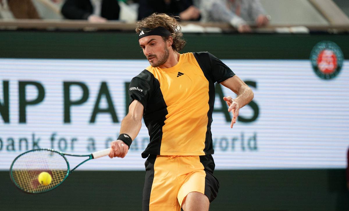 Jun 4, 2024; Paris, France; Stefanos Tsitsipas of Greece returns a shot during his match against Carlos Alcaraz of Spain on day 10 of Roland Garros at Stade Roland Garros. Mandatory Credit: Susan Mullane-USA TODAY Sports 