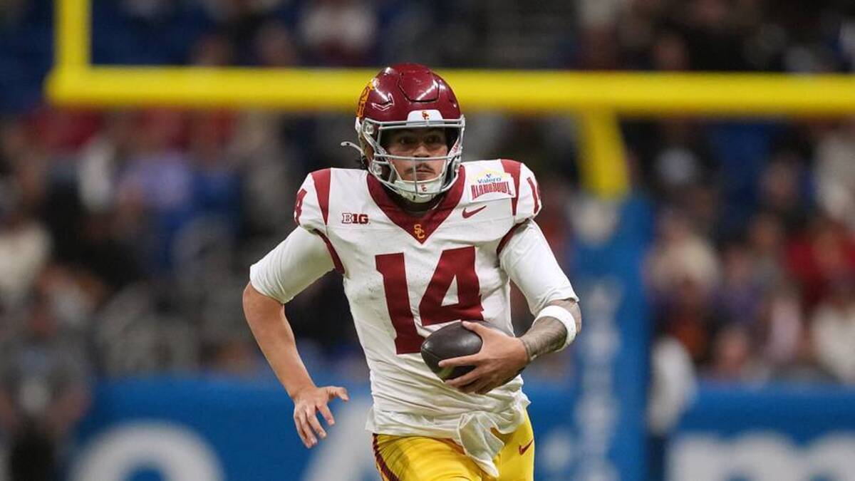  Dec 30, 2025; San Antonio, TX, USA; Southern California Trojans quarterback Jayden Maiava (14) carries the ball against the TCU Horned Frogs in the second half during the Alamo Bowl at Alamodome. Mandatory Credit: Kirby Lee-Imagn Images | Kirby Lee-Imagn Images 