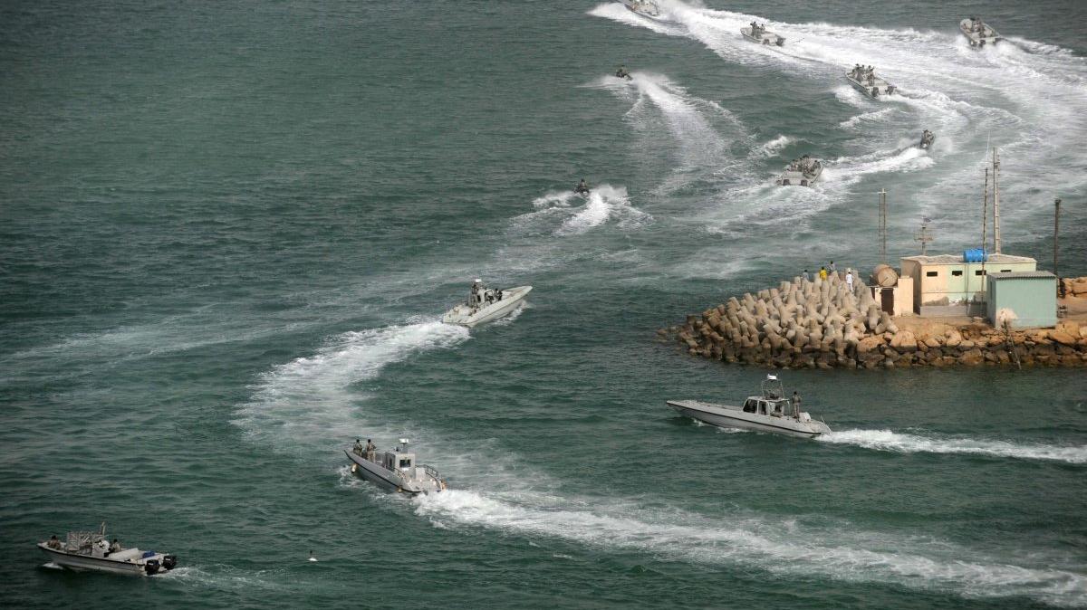 At least two cargo ships reported being fired on near the key Strait of Hormuz shipping lane where Tehran is once again jockying with the United States for control in a long-simmering dispute illustrated by this view of Iranian navy speed boats conducting military exercises off southern Iran back in 2011. File photo by Ali Mohammadi/IIPA/UPI