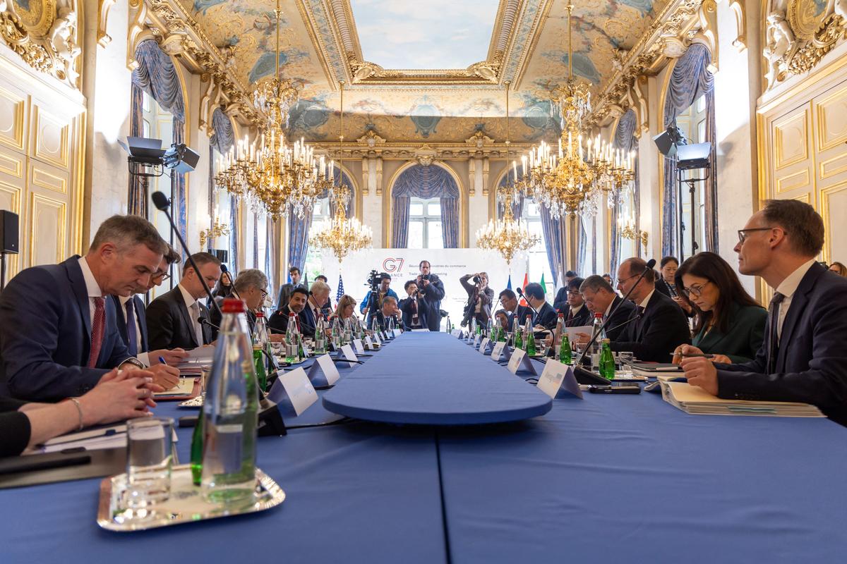 Ministers and members of the delegations sit around the table for the opening session of  the G7 trade ministers' meeting in Paris, France, 06 May 2026. CHRISTOPHE PETIT TESSON/Pool via REUTERS