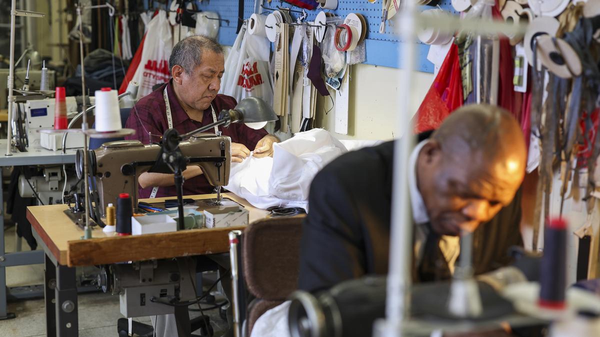 Tailors Nolberto Campero, left, and Alani Peter Folahan make clothing repairs at Tailorite Complete Clothing Care in Chatham, Illinois, on April 13, 2026. (Eileen T. Meslar/Chicago Tribune/TNS)