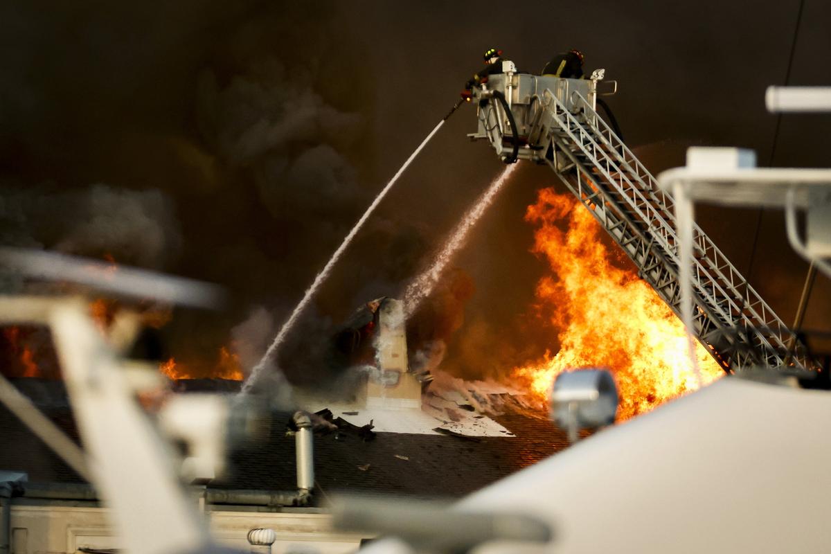  Firefighters battle a fire at the University of South Florida campus Saturday, May 2, 2026, in St. Petersburg.=, Fla. (Luis Santana/Tampa Bay Times via AP) 