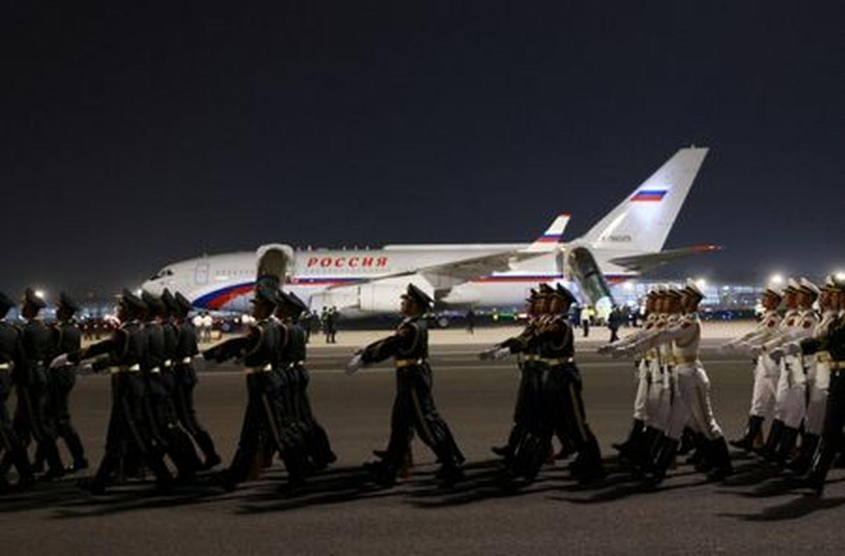 Chinese honour guards march in formation near the aircraft carrying Russian President Vladimir Putin upon his arrival at an airport in Beijing, China, May 19, 2026. Sputnik/Vladimir Smirnov/Pool via REUTERS ATTENTION EDITORS - THIS IMAGE WAS PROVIDED BY A THIRD PARTY.