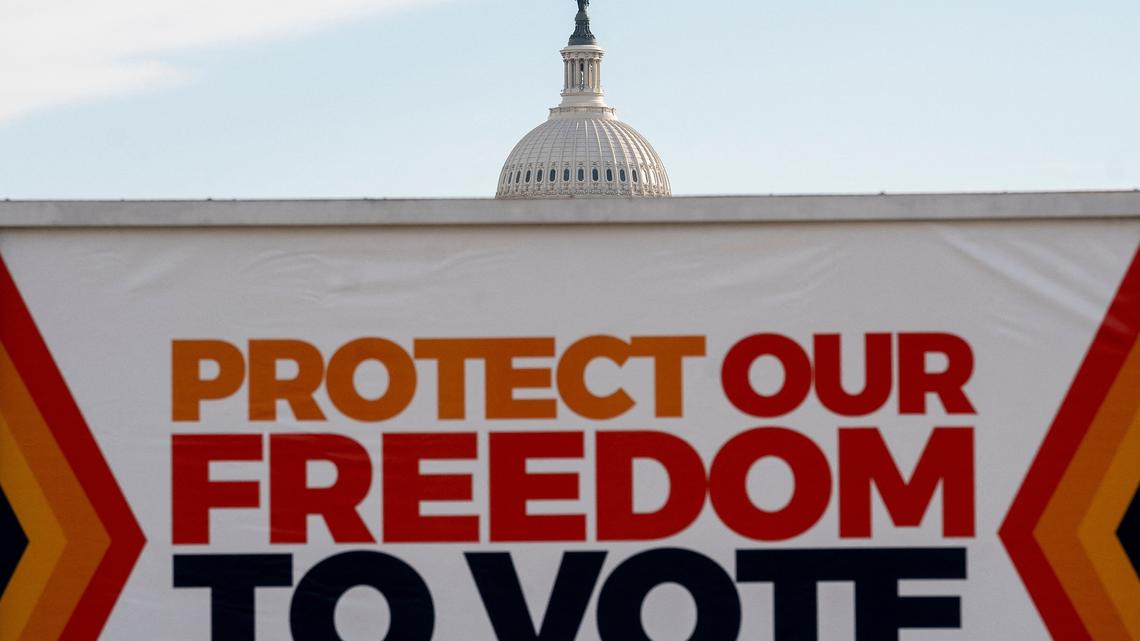 A vehicle displays a sign reading Protect Our Freedom To Vote in front of the U.S. Capitol in Washington, D.C., on Jan. 19, 2022. (Stefani Reynolds/AFP/Getty Images/TNS)
