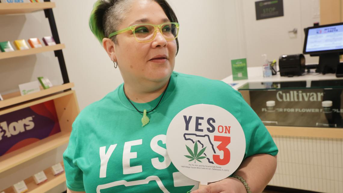 Gabriella Medina, a customer experience program manager with Trulieve, displays support for Florida’s Amendment 3, on the ballot for November 2024, which proposes legalizing the personal and recreational use of marijuana for adults aged 21 and over, during a press conference organized by Smart & Safe Florida on Tuesday, Oct 22, 2024, the group sponsoring Amendment 3, at one of Trulieve’s stores in Tampa, Florida. (Douglas R. Clifford/Tampa Bay Times/TNS)