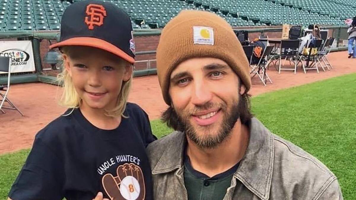  Striker has spent plenty of time around big leaguers, including his self-professed No. 1 fan, Madison Bumgarner. | Courtesy of Pence Family 
