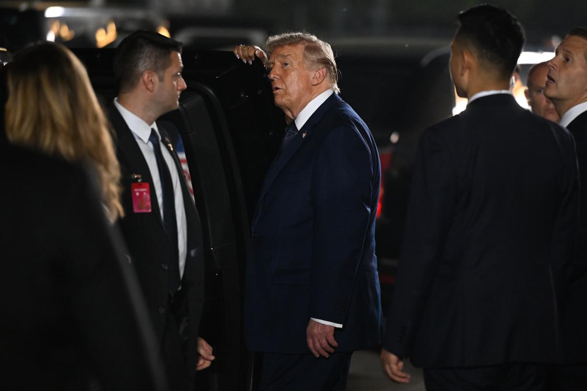 President Donald Trump departs the Great Hall of the People in Beijing after a state banquet with President Xi Jinping of China, on Thursday, May 14, 2026. Trump invited Xi to Washington in September as the two leaders emphasized their cooperation against the ornate backdrop of the Great Hall of the People. (Kenny Holston/The New York Times)..