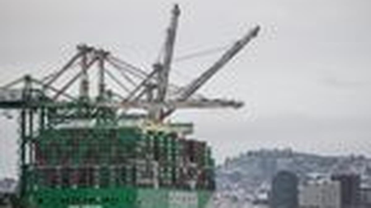 FILE PHOTO: Shipping containers are stacked on a cargo ship at the port of Oakland in Oakland, California, U.S., February 24, 2026. REUTERS/Carlos Barria/File Photo