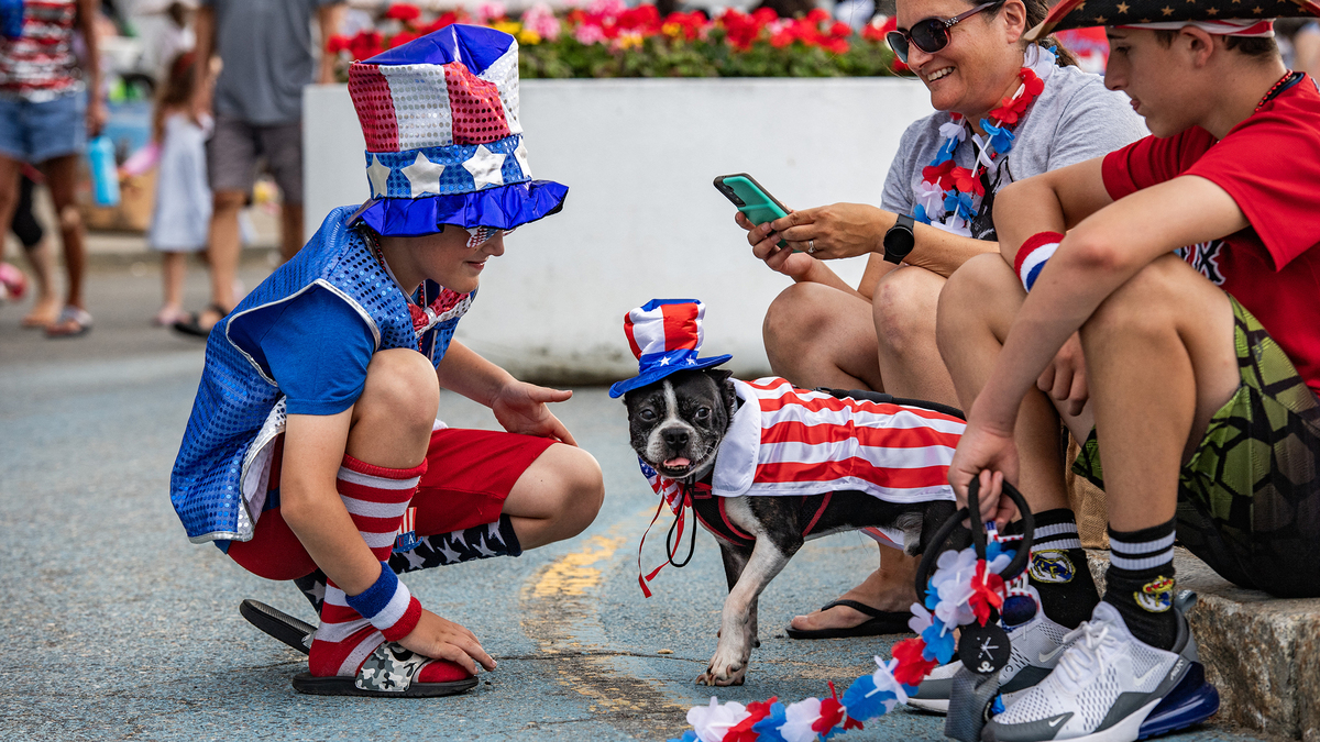 A dog dressed in a US flag and hat is seen during the 17th annual Fourth of July Pet Parade in Salisbury, Massachusetts, on July 4, 2024. The event is run by the Salisbury beach partnership. (Joseph Prezioso/AFP via Getty Images/TNS)