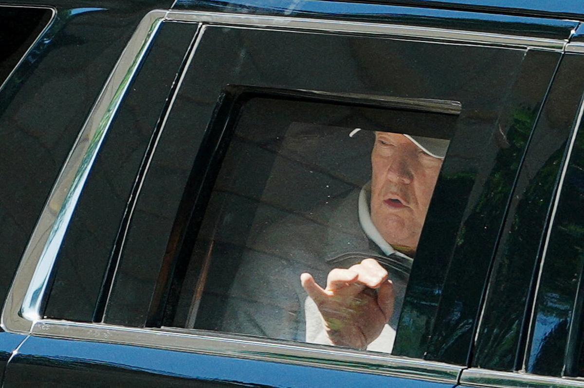 U.S. President Donald Trump looks out of the window of the limousine known as "The Beast", and points towards the construction, as he departs the White House for Trump National Golf Club in Sterling, Virginia, in Washington, D.C., U.S., May 30, 2026. REUTERS/Aaron Schwartz