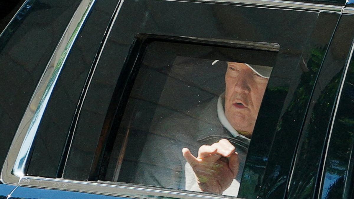 U.S. President Donald Trump looks out of the window of the limousine known as "The Beast", and points towards the construction, as he departs the White House for Trump National Golf Club in Sterling, Virginia, in Washington, D.C., U.S., May 30, 2026. REUTERS/Aaron Schwartz