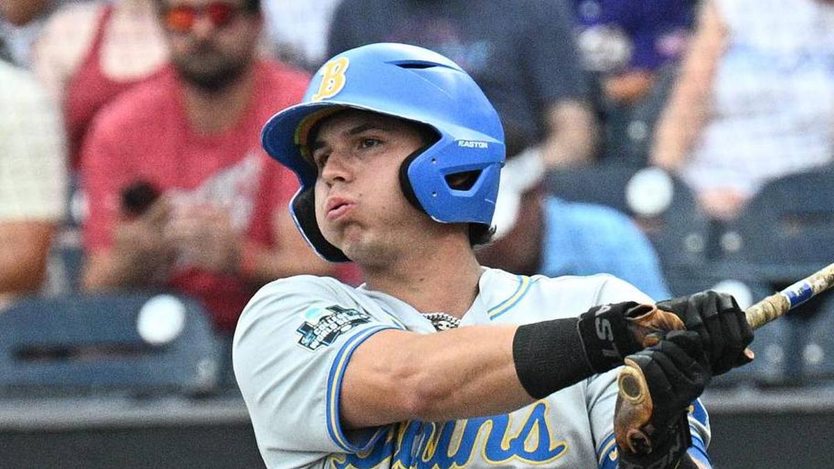  Jun 16, 2025; Omaha, Neb, USA; UCLA Bruins third baseman Roman Martin (7) doubles in a run against the LSU Tigers during the first inning at Charles Schwab Field. Mandatory Credit: Steven Branscombe-Imagn Images | Steven Branscombe-Imagn Images 