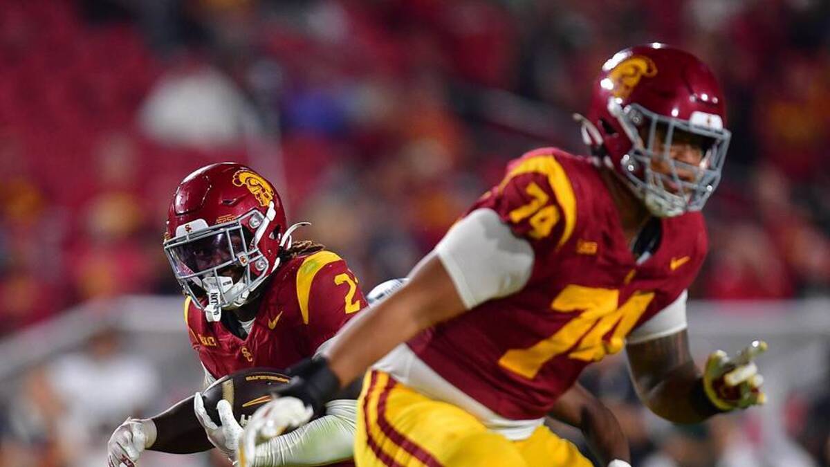  Sep 20, 2025; Los Angeles, California, USA; Southern California Trojans running back Waymond Jordan (2) runs the ball as offensive lineman Justin Tauanuu (74) provides coverage against the Michigan State Spartans during the second half at the Los Angeles Memorial Coliseum. Mandatory Credit: Gary A. Vasquez-Imagn Images | Gary A. Vasquez-Imagn Images 