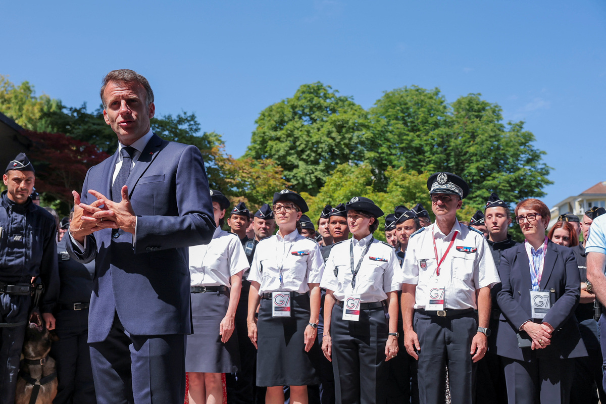 French President Emmanuel Macron visits emergency forces, on the day of the G7 Summit in Evian-les-Bains, France, June 15, 2026. REUTERS/Christian Hartmann/Pool