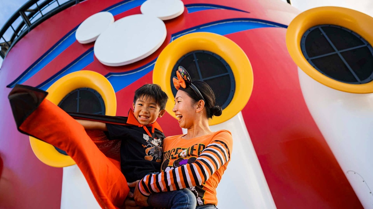 A mother and son in Halloween attire on deck during a Disney Cruise Line Halloween on the High Seas sailing. 