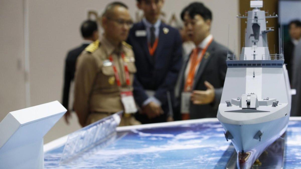 A Thai Navy officer inspects a model of a second frigate warship developed by South Korean shipbuilder Hanwha Ocean at the Defense and Security 2025 exhibition in Nonthaburi, on the outskirts of Bangkok, Thailand. Photo by RUNGROJ YONGRIT / EPA