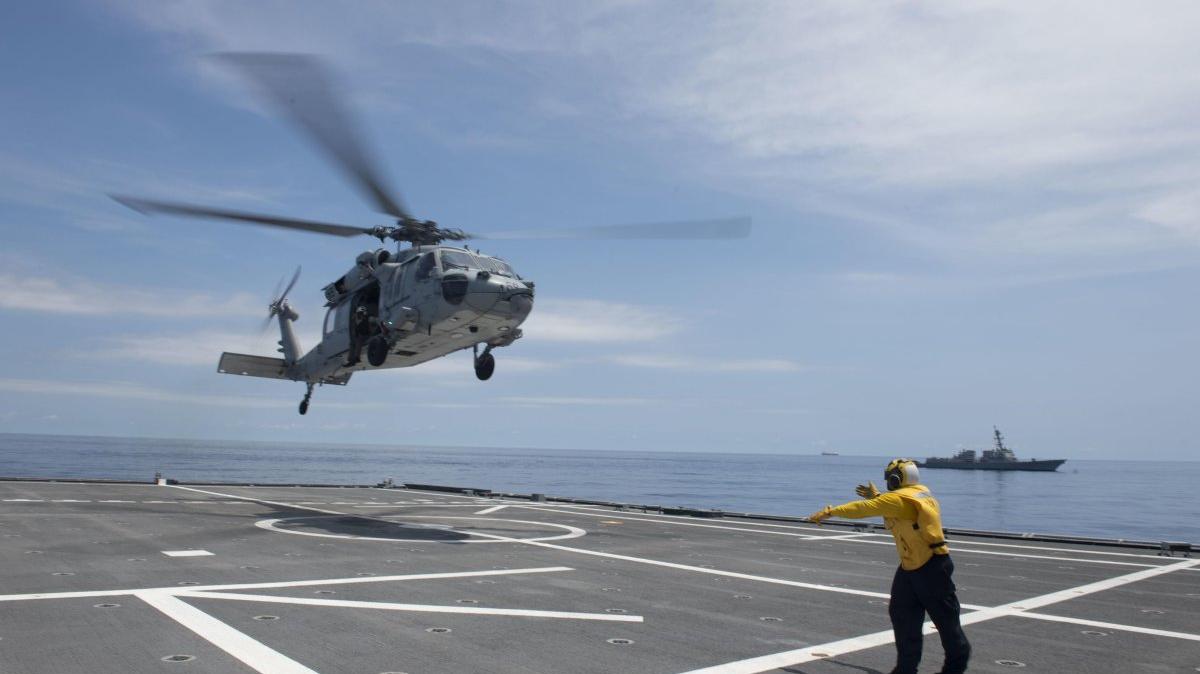 Sailors assigned to the USS Tulsa and Helicopter Sea Combat Squadron 21 conduct flight operations in 2021 while sailing with the USS Kidd in the South China Sea. The Chinese military said Wednesday that it drove off a Dutch frigate sailing near the disputed Paracel Islands in the region. File Photo by Mass Communication Specialist 3rd Class Chase Stephens/U.S. Navy
