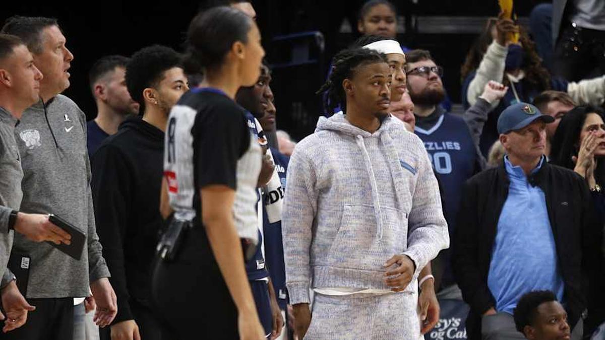  Jan 23, 2026; Memphis, Tennessee, USA; Memphis Grizzlies guard Ja Morant (12) looks on from the bench area during the fourth quarter against the New Orleans Pelicans at FedExForum. Mandatory Credit: Petre Thomas-Imagn Images | Petre Thomas-Imagn Images 