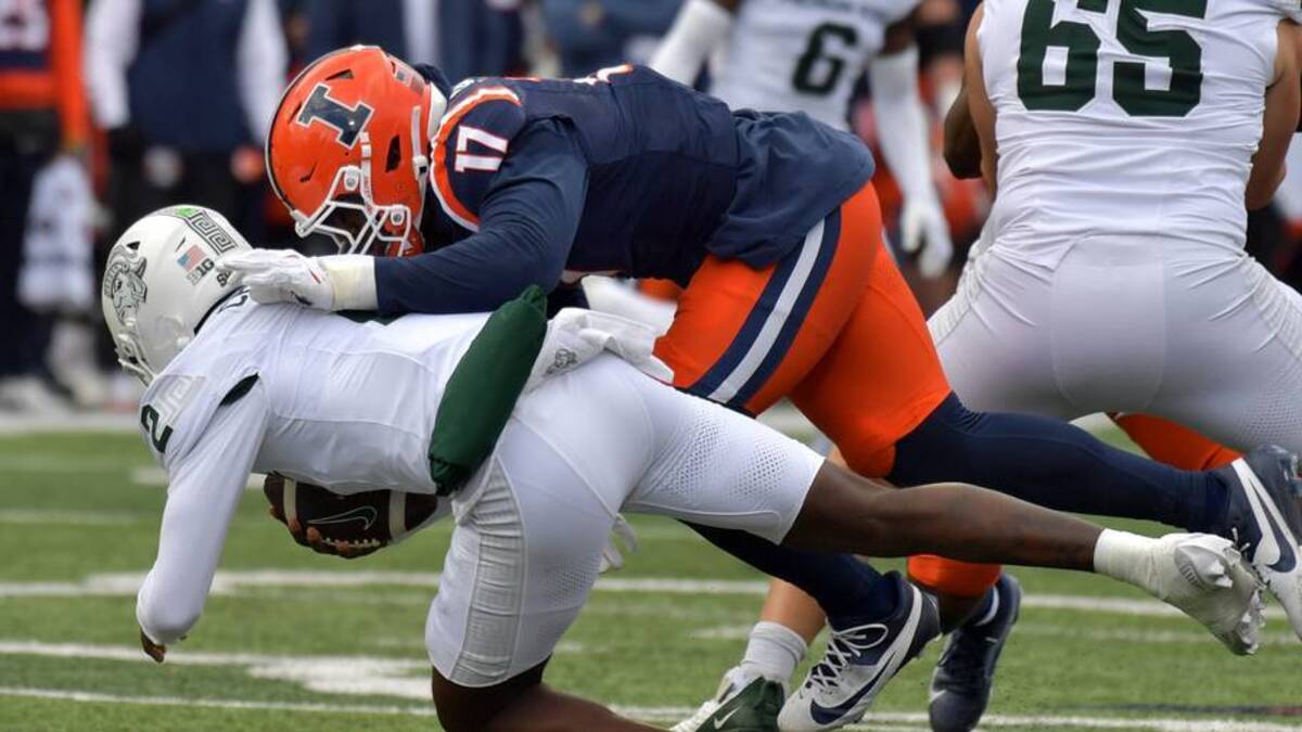  Nov 16, 2024; Champaign, Illinois, USA; Illinois Fighting Illini linebacker Gabe Jacas (17) sacks Michigan State Spartans quarterback Aidan Chiles (2) during the first half at Memorial Stadium. Mandatory Credit: Ron Johnson-Imagn Images | USA TODAY Sports via Reuters Connect 