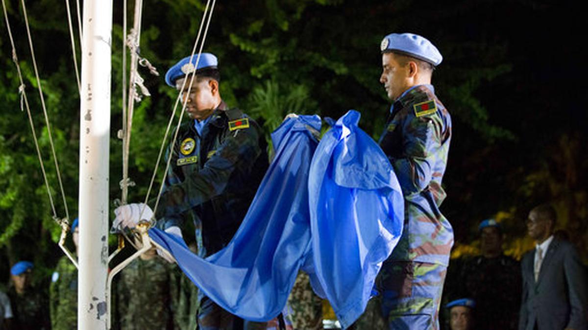 United Nations peacekeepers lower the flag when the United Nations Stabilization Mission in Port-au-Prince ended in 2017..