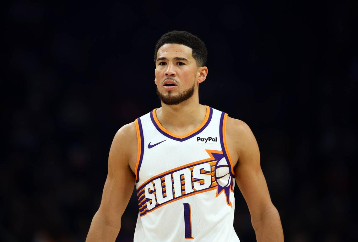  Phoenix Suns guard Devin Booker (1) © Mark J. Rebilas-Imagn Images