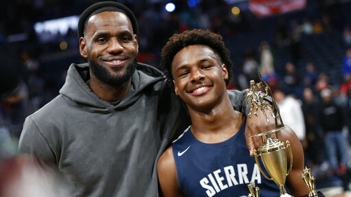 LeBron James, left, poses with his son Bronny after Sierra Canyon beat Akron St. Vincent - St. Mary in a high school basketball game, Saturday, Dec. 14, 2019, in Columbus, Ohio.
