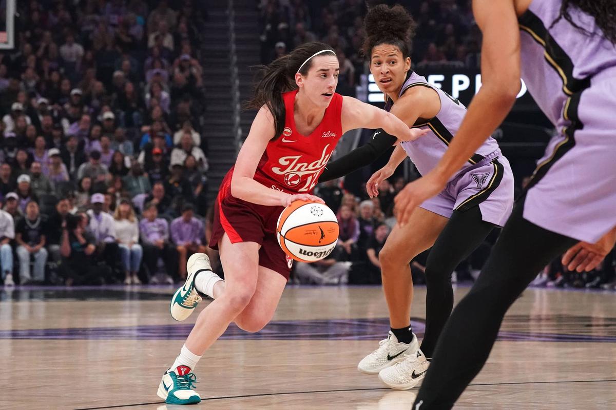  May 28, 2026; San Francisco, California, USA; Indiana Fever guard Caitlin Clark (22) dribbles past Golden State Valkyries guard Veronica Burton (22) in the first quarter at Chase Center. Mandatory Credit: David Gonzales-Imagn Images 