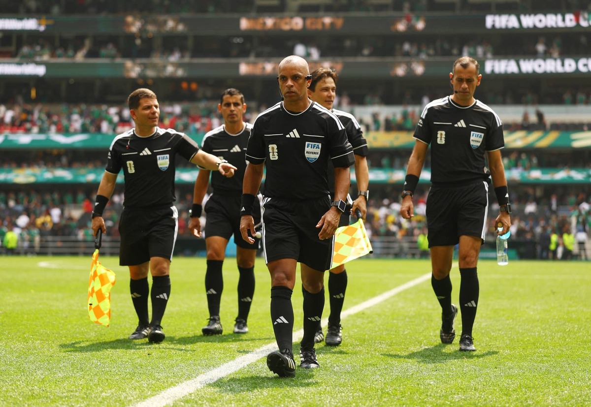  Referee Wilton Sampaio with assistant referees and reserve assistant referee after the Group A game, Mexico v South Africa. REUTERS/Hannah Mckay