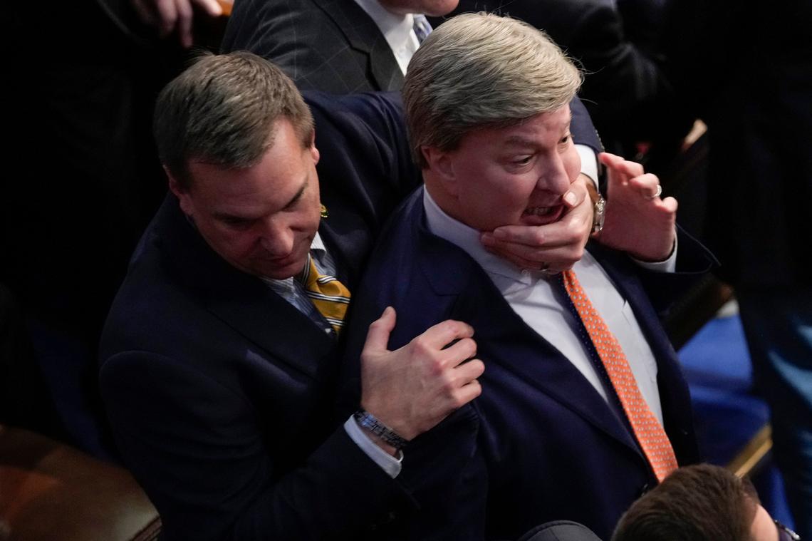 Rep. Richard Hudson, R-N.C., left, pulls Rep. Mike Rogers, R-Ala., back as they talk with Rep. Matt Gaetz, R-Fla., and other during the 14th round of voting for speaker as the House meets for the fourth day to try and elect a speaker and convene the 118th Congress in Washington, Friday, Jan. 6, 2023.