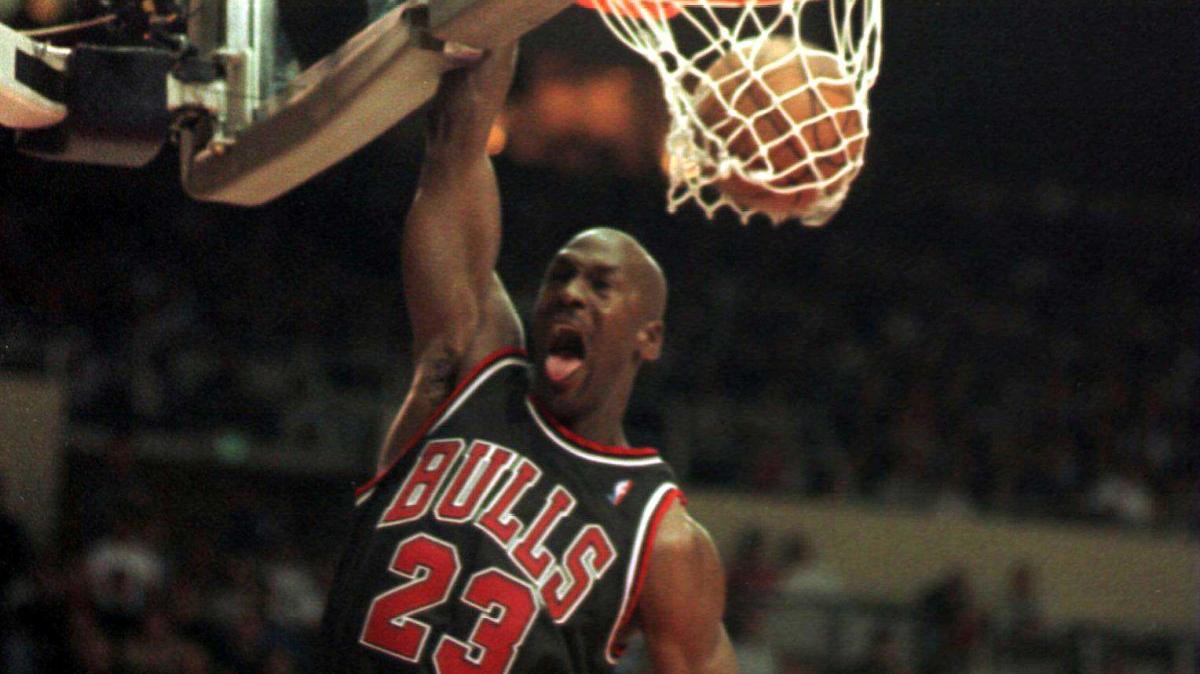 Chicago Bulls guard Michael Jordan jams for two of his game-high 50 points during fourth-quarter action November 21, 1997, to defeat the Los Angeles Clippers 111-102 in two overtimes. On May 16, 1985, the NBA named Jordan rookie of the year after he led all players in points. File Photo by Jim Ruymen/UPI
