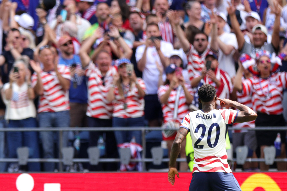  Folarin Balogun #20 of the United States celebrates the team’s first goal, scored an own goal by Cameron Burgess #21 (not pictured) of Australia, during the FIFA World Cup 2026 Group D match between the USA and Australia at Seattle Stadium on June 19, 2026, in Seattle, Washington. (Photo by John Dorton/USSF/Getty Images) 