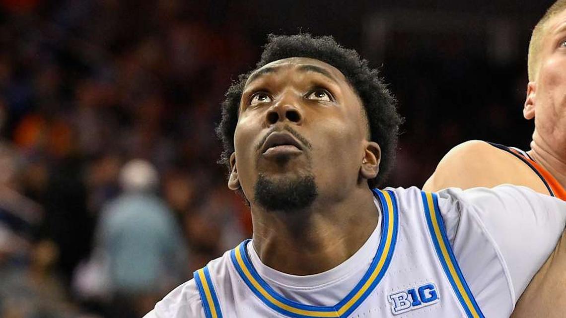  Feb 21, 2026; Los Angeles, California, USA; UCLA forward Xavier Booker (1) tangles up with Illinois forward Ben Humrichous (3) under the basket during the second half at Pauley Pavilion presented by Wescom Financial. Mandatory Credit: Robert Hanashiro-Imagn Images | Robert Hanashiro-Imagn Images 