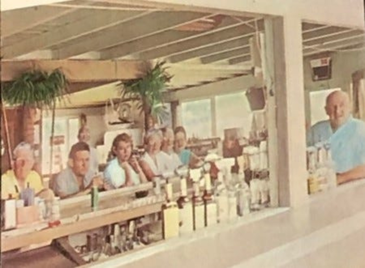 This circa 1960s photo is one of only two TCPalm could find of Grace Marie Dixon Powers Martin (far right behind bar in blue dress and signature red hair), who owned Earl's Hideaway from 1965 until she died in 1973. Grace's first husband in 1918 was Sammy Powers, who was on the inaugural 1919 Green Bay Packers through 1921 and played in four NFL games. Though Earl never divorced wife Beatrice nor married Grace, she was called "Mrs." and his "wife." They knew each other from the famous Showboat big-band dance palace Earl built in New York in 1930. They moved to New Smyrna Beach in 1942 and Sebastian in 1946. The original Earl's Bar and Package Store was in the Sebastian Inn on the Indian River Lagoon, built in 1925 and opened in 1926. Earl bought the hotel in 1944, but didn't reopen until after the Navy vacated in 1946, having immediately commandeered it for WWII barracks. They lived in the hotel and Grace was assistant manager and restaurant hostess. After the hotel was foreclosed and sold in 1955, the couple moved the bar '3/4 miles north on left,' a sign said. In 1960, they co-leased a bar, restaurant and two cottages at 1405 Indian River Drive, where they lived. In 1965, Grace bought the property; the state liquor license was in her name; and they soon renamed the bar Earl's Hideaway. When Earl and Grace moved to a Melbourne nursing home in 1972, the bar was run by her daughter, Jeanne Dorothy Powers Braley Kelly Johnson. Jeanne's father and Grace's first husband in 1918 was Samuel "Sam or Sammy" Richard Powers, who was on the inaugural Green Bay Packers from 1919-21. Jeanne ran the bar with son Tim Kelly until she sold it in 1977.
