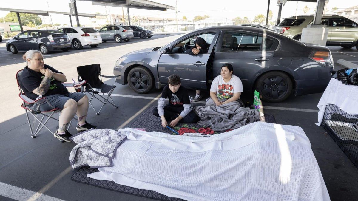 Andrea Luna, Jules Olivas, Joshua Olivas and Jessica Castro of Anaheim, Calif., shelter in their cars at the John F. Kennedy High School evacuation center on Saturday after leaving their home due to a chemical leak from a storage tank at the GKN Aerospace facility in Garden Grove, Calif. A failing 34,000-gallon tank of methyl methacrylate overheated, prompting tens of thousands of evacuations in the Garden Grove area. Photo by Ted Soqui/EPA