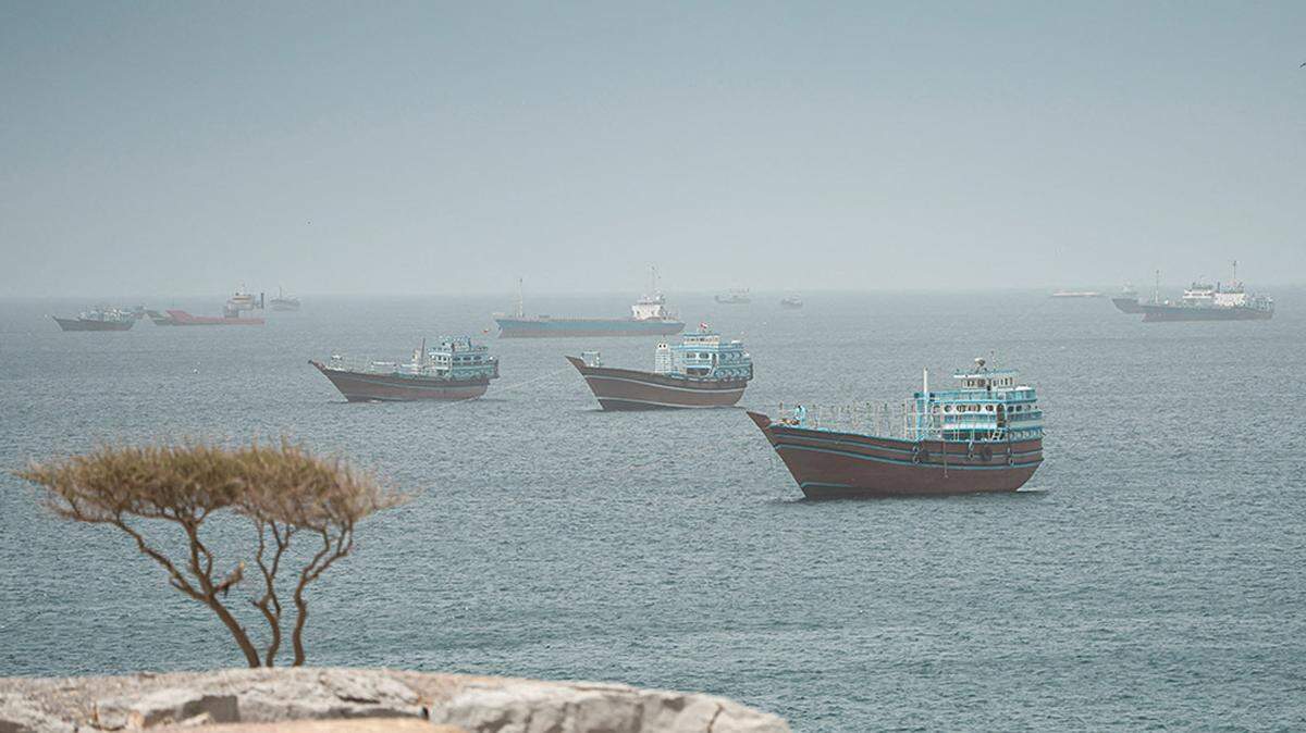 Vessels sail through the Strait of Hormuz of Musandam, Oman, on Wednesday. President Donald Trump on Wednesday said the U.S. was ready to proceed with further attacks if Iran did not agree to a peace deal, but suggested Washington could wait a few days to “get the right answers.”