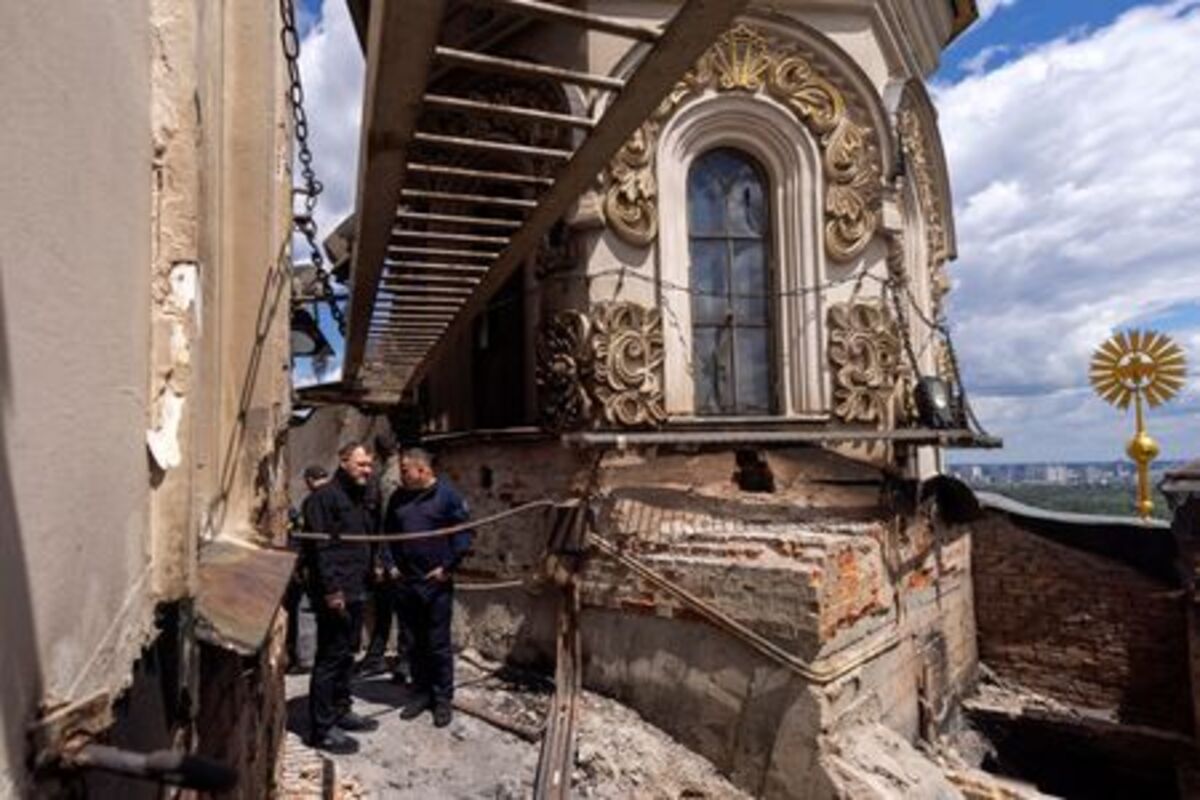 Ukrainian Minister of Internal Affairs Ihor Klymenko inspects the roof the Dormition Cathedral of the Kyiv Pechersk Lavra, after it was hit during yesterday’s Russian missile and drone strikes, amid Russia's attack on Ukraine, in Kyiv, Ukraine June 16, 2026.  REUTERS/Thomas Peter