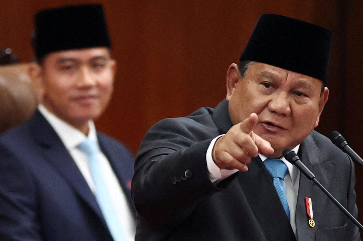Indonesian President Prabowo Subianto gestures while delivering his speech on economic policies and 2027 fiscal plan to parliament members, as Vice President Gibran Rakabuming Raka reacts, at the parliament building in Jakarta, Indonesia, May 20, 2026. REUTERS/Willy Kurniawan