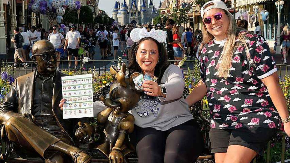 Myriam Estrella and her friend in Disney World collecting Hidden Mickey Wave A pinsMyriam Estrella