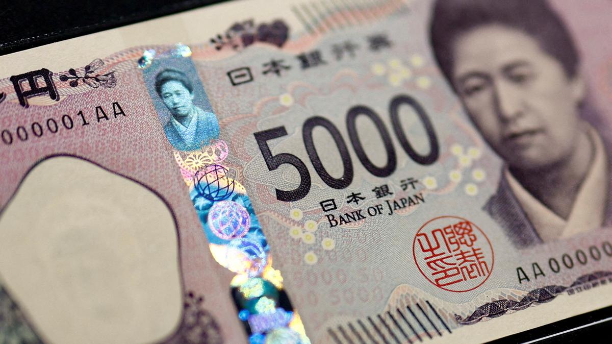 Holograms, which show different images and colours depending on the angle at which they are viewed, are seen on the new Japanese 5,000 yen banknote as the new note is displayed at a currency museum of the Bank of Japan, on the day the new notes of 10,000 yen, 5,000 yen and 1,000 yen went into circulation, in Tokyo, Japan July 3, 2024. REUTERS/Issei Kato/Pool