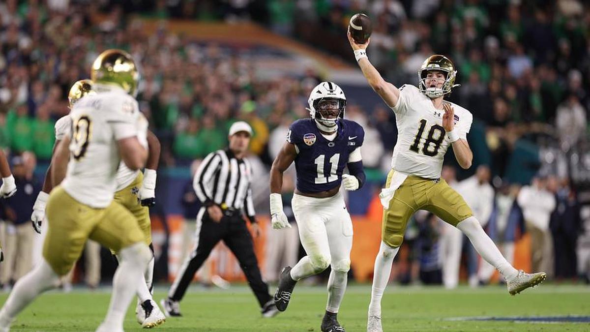  Jan 9, 2025; Miami, FL, USA; Notre Dame Fighting Irish quarterback Steve Angeli (18) throws the ball in the first half against the Penn State Nittany Lions in the Orange Bowl at Hard Rock Stadium. | Nathan Ray Seebeck-Imagn Images 