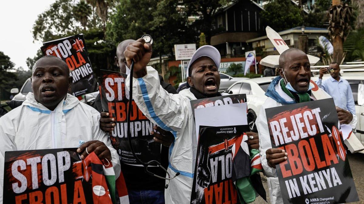 Activists shout slogans outside the Ministry of Health Headquarters in protest against an American Ebola quarantine facility in Nairobi, Kenya, Tuesday. Photo by Daniel Irungu/EPA