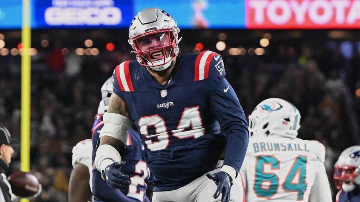  Jan 4, 2026; Foxborough, Massachusetts, USA; New England Patriots defensive tackle Cory Durden (94) reacts to a defensive stop against the Miami Dolphins during the first half at Gillette Stadium. Mandatory Credit: Brian Fluharty-Imagn Images | Brian Fluharty-Imagn Images 
